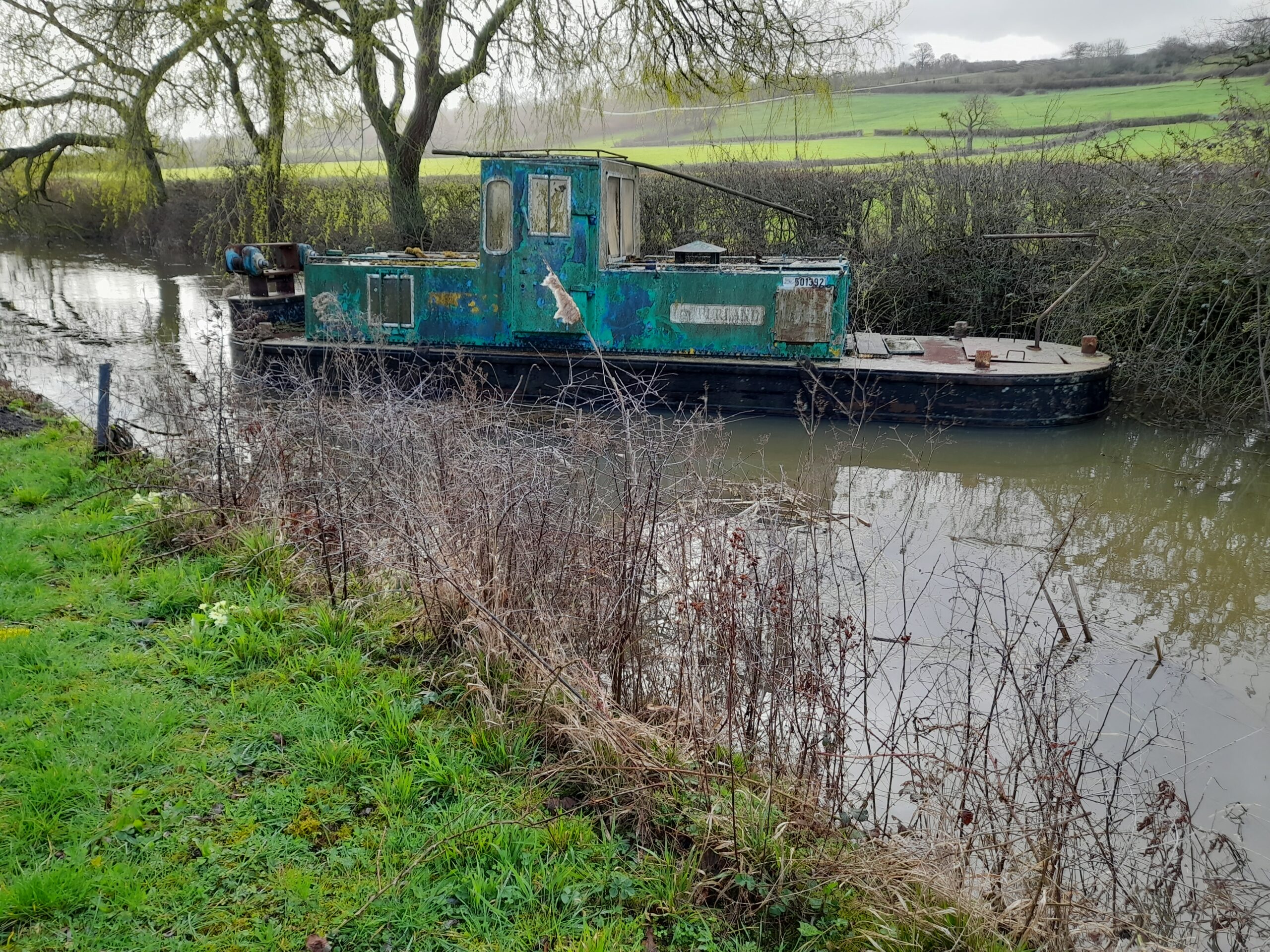 Rachael’s tug boat in the canal at Dauntsey Lock